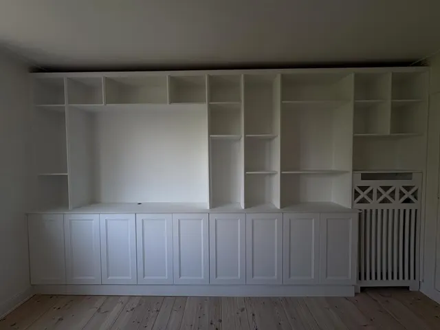 Custom made cabinets with a radiator cover